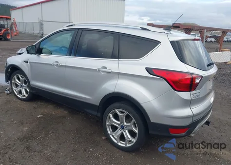 2019 Ford Escape Titanium z USA, uszkodzony, nr VIN 1FMCU9J90KUB29009